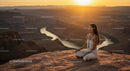 Woman Meditating at Sunset in Scenic Canyon Landscape