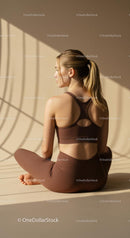 Woman Practicing Yoga in Brown Activewear
