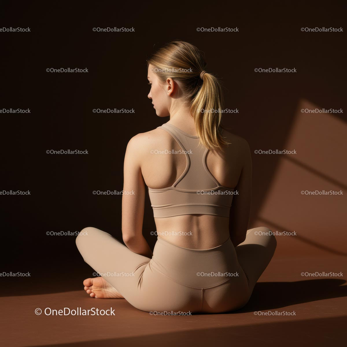 Woman Meditating in Peaceful Yoga Pose in Warm Lighting