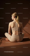 Woman Practicing Yoga in Beige Activewear