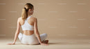 Woman Meditating in Brown Outfit on Yoga Mat