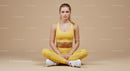 Woman Meditating in Brown Outfit on Yoga Mat