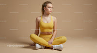 Woman Meditating in Brown Outfit on Yoga Mat