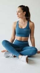Athletic Woman Sitting in Yoga Pose Wearing Blue Outfit