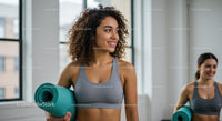 Women in Activewear with Yoga Mats in Bright Studio