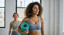 Women in Yoga Class Holding Mat with Natural Light