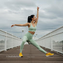 Athletic Woman Practicing Yoga on a Bridge