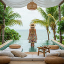 Woman in Floral Dress Standing by an Infinity Pool