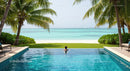 Infinity Pool Overlooking Tropical Beach and Ocean