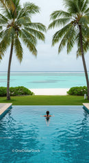Relaxing in Infinity Pool Overlooking Tropical Beach