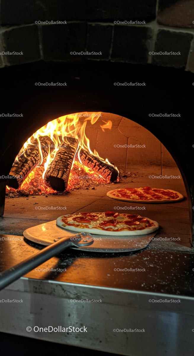 Pepperoni Pizza Baking in Wood-Fired Oven