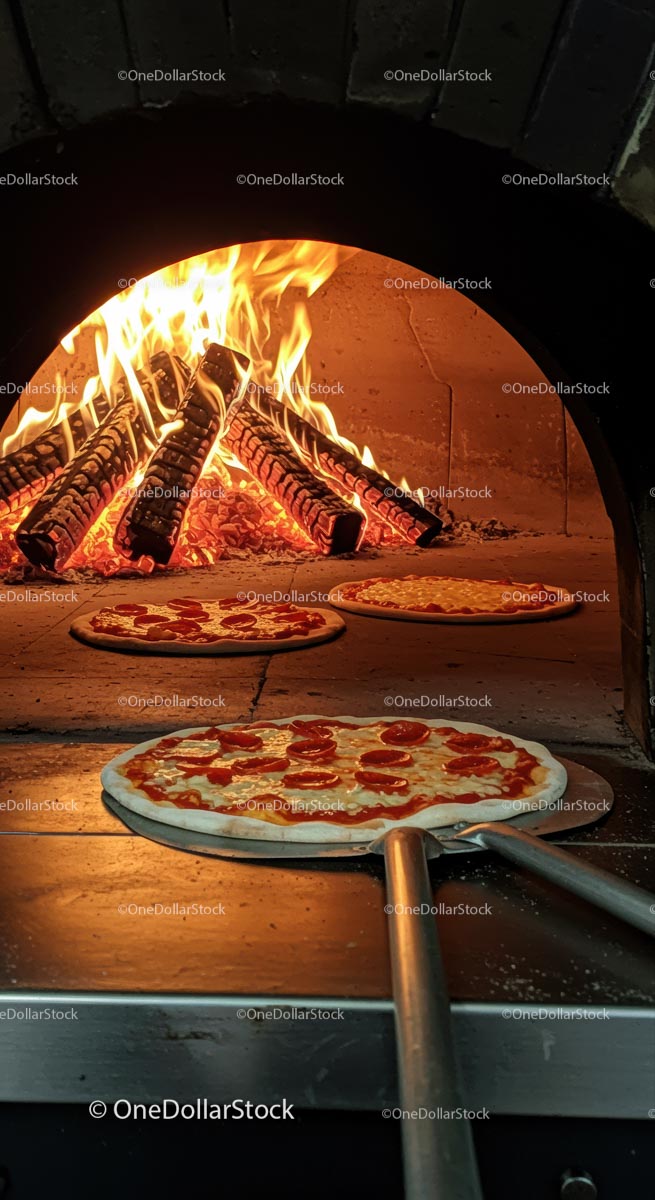 Pepperoni Pizzas in a Wood-Fired Oven