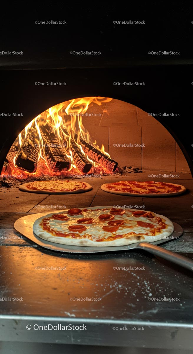 Delicious Pepperoni Pizza Baking in Wood-Fired Oven
