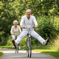 Senior Couple Enjoying a Joyful Bicycle Ride in Nature