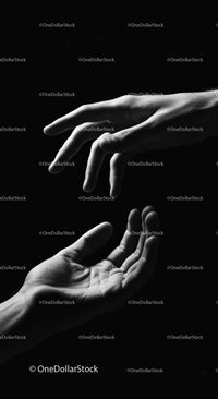 Black and White Reaching Hands in Dramatic Light