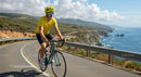Cyclist on Scenic Coastal Road with Ocean View
