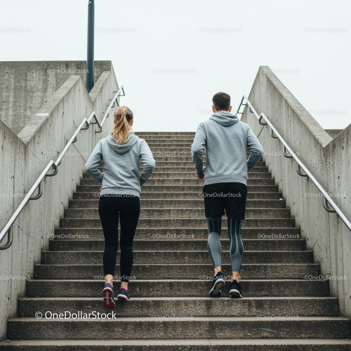 Couple Running Up Stairs for Urban Fitness Workout