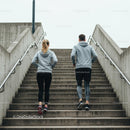 Couple Running Up Stairs for Urban Fitness Workout