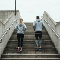 Couple Running Up Stairs for Urban Fitness Workout