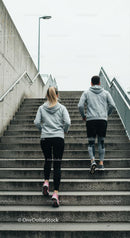 Couple Climbing Concrete Stairs for Morning Workout