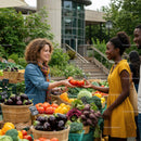 Women Exchanging Fresh Tomatoes at Farmers Market