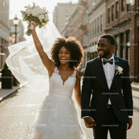 Joyful Bride and Groom Walking on a Sunny City Street