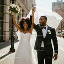 Joyful Newlyweds Celebrating in Urban Cityscape