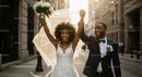 Joyful Bride and Groom Celebrating on City Street
