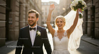 Joyful Bride and Groom Celebrating in Sunlit City Street