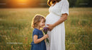 Pregnant Mother and Daughter in Sunny Meadow