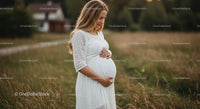 Expecting Mother in White Dress in Grassy Field