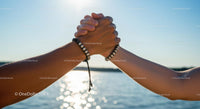 Unity and Friendship with Handshake by the Sea