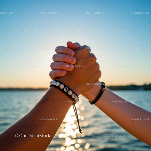 Unity and Friendship Handshake at Sunset by the Ocean