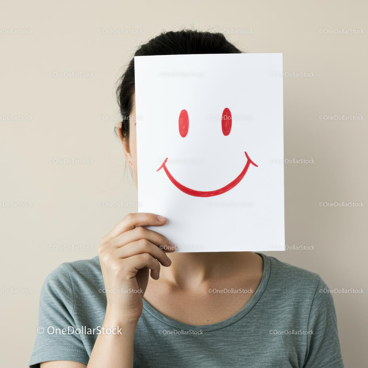 Playful Woman Hiding Face with Smiley Sign