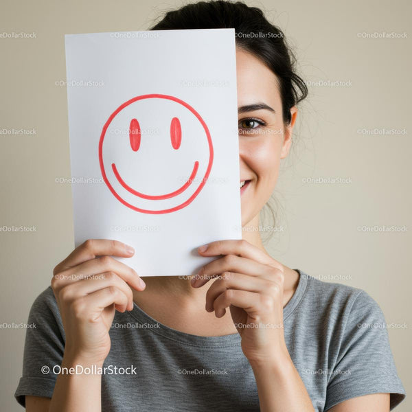 Playful Woman Holding Smiley Face Drawing