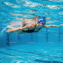 Female Athlete Swimming Freestyle Underwater in Pool
