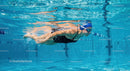 Professional Swimmer Gliding Underwater in Pool