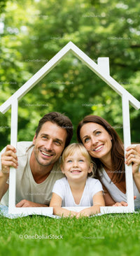 Happy Family Framing New Home in Green Garden