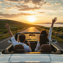 Couple on Scenic Sunset Drive in Convertible Car