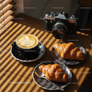 Delicious Croissants and Latte with Vintage Camera