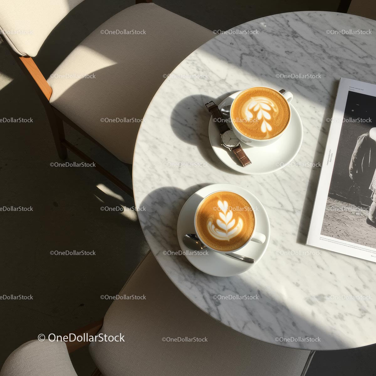 Two Lattes on a Sunlit Marble Cafe Table