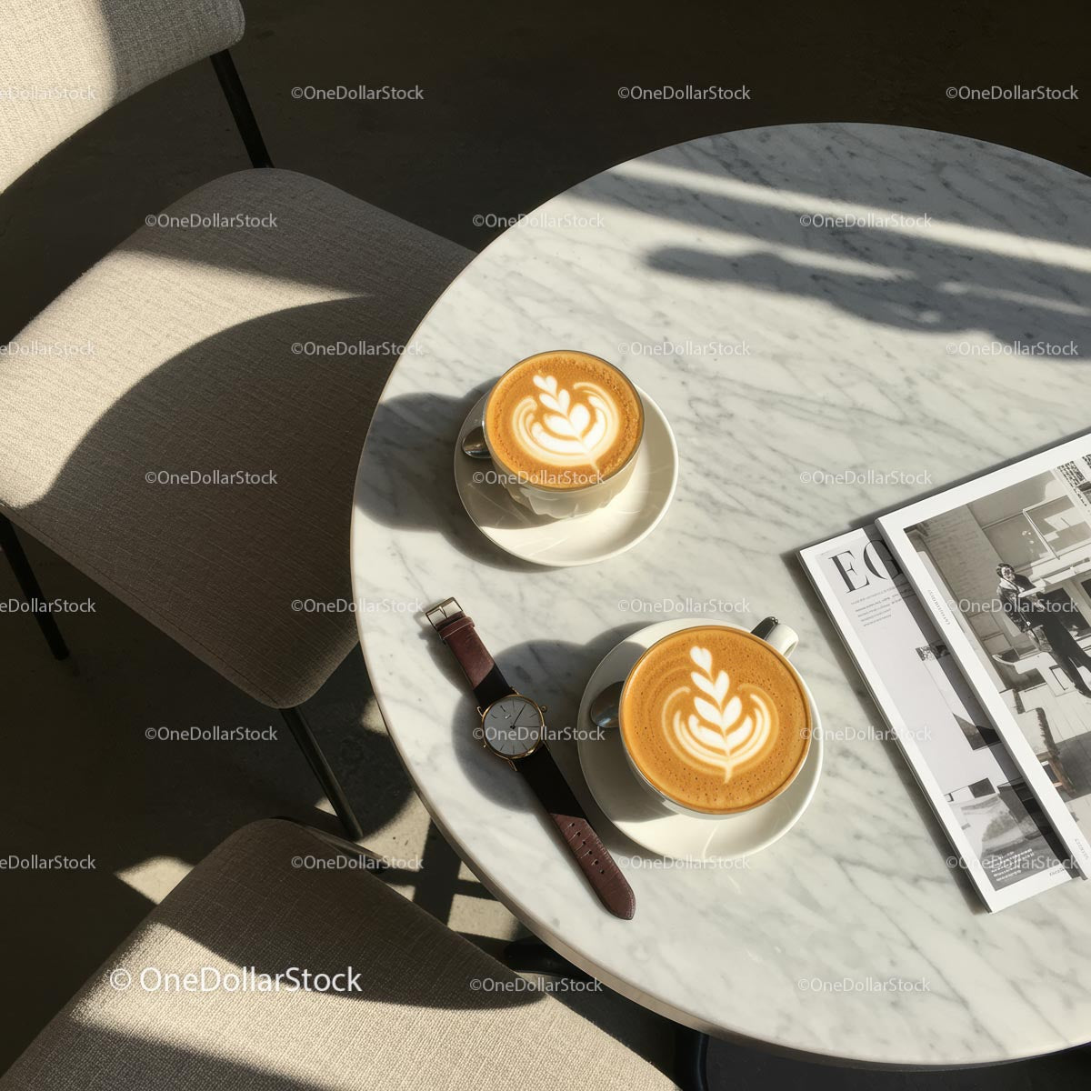 Latte Art on Marble Table with Fashion Magazine and Watch