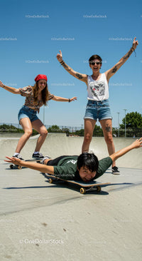 Friends Enjoying Skateboarding in the Park