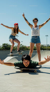 Group of Friends Enjoying Skateboarding in a Sunny Park