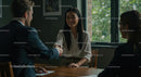 Business Professionals Shaking Hands in Office Meeting