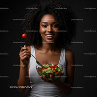 Smiling Woman Enjoying a Fresh Salad with Cherry Tomatoes