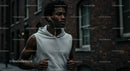 Focused Jogger Running Through Urban Streets in the Morning
