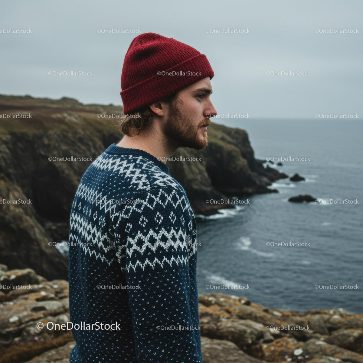 Man in Red Beanie Overlooking Ocean Cliffs