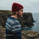 Man in Red Beanie Overlooking Rugged Cliffs