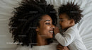 Joyful Mother and Child Embracing in Cozy Setting